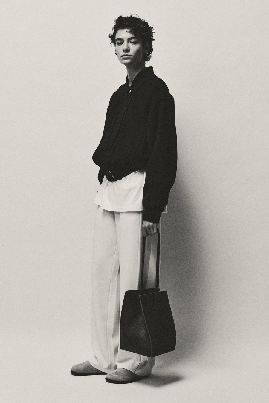 Anna Lee wears the Giles Bomber and Angus Pant with the Perine Bag and Lou Clog. 